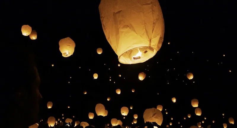 Released in paper lanterns over water